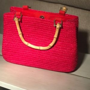 Pink handbag with bamboo handles